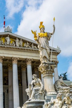 View of the statue of Pallas Athena situated in front of the parliament building in Vienna, Austria.
