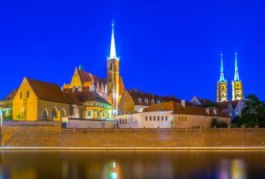 Night view of church of the Holy Cross and St Bartholomew and cathedral of saint john the baptist in Wroclaw, Polan