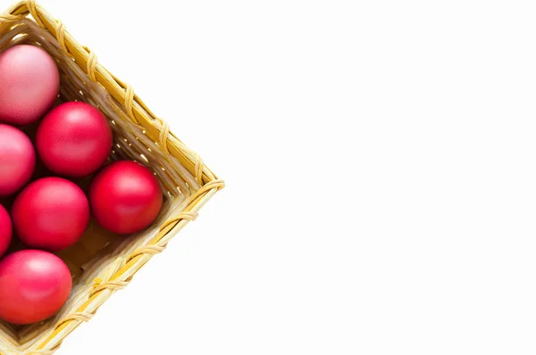 Colorful eggs in a basket — Stock Photo, Image