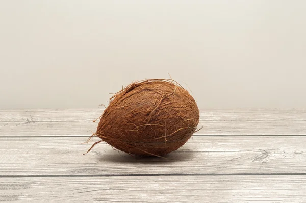 Coconuts close up on wooden board — Stock Photo, Image