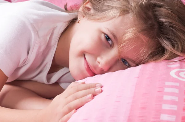 Beautiful girl in the pink sheets — Stock Photo, Image
