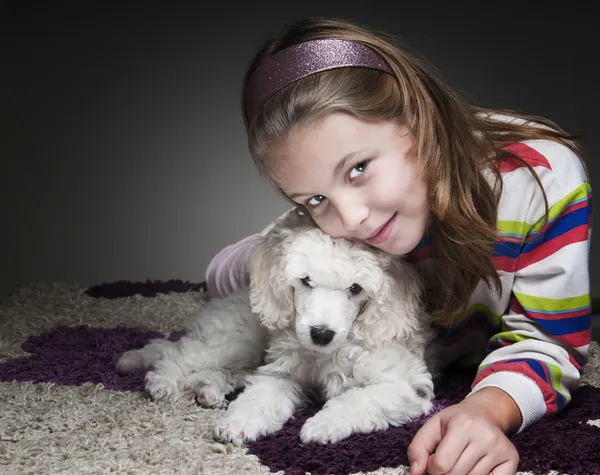 Girl with puppy Stock Image