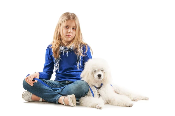 Chica con perro blanco — Foto de Stock