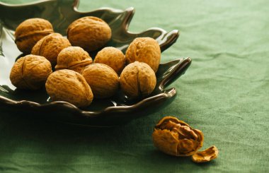 close up of walnuts in bowl, food background, healthy eating