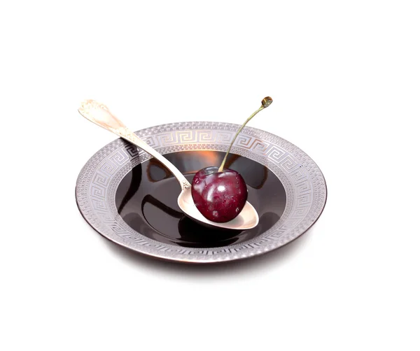 Berry of a sweet cherry in the silver spoon — Stock Photo, Image