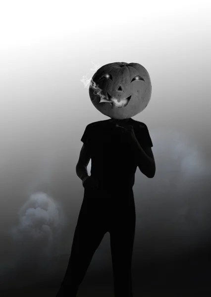person with a head-pumpkin