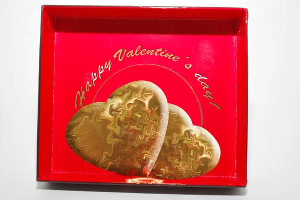 Two gold hearts in a red box — Stock Photo, Image