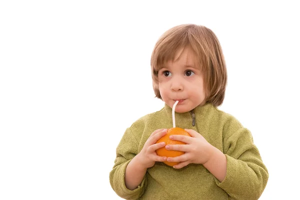 Child drinking orange juice — Stock Photo, Image
