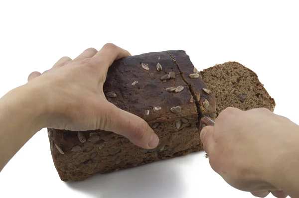 Cutting Brown Bread — Stock Photo, Image