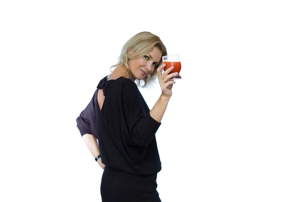 Mujer atractiva con bebida roja Imagen de archivo