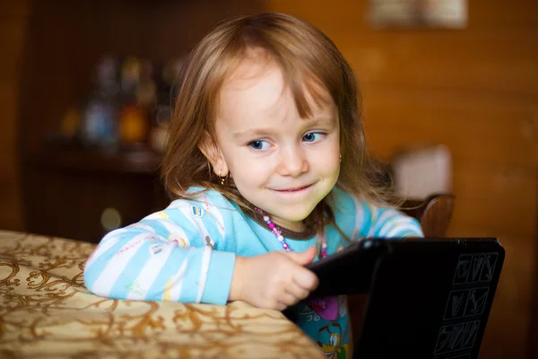 Small girl at the table