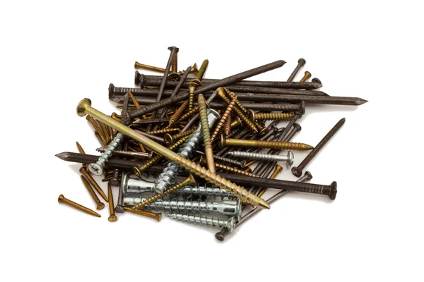 A handful of small construction nails on a white background. Stock Photo