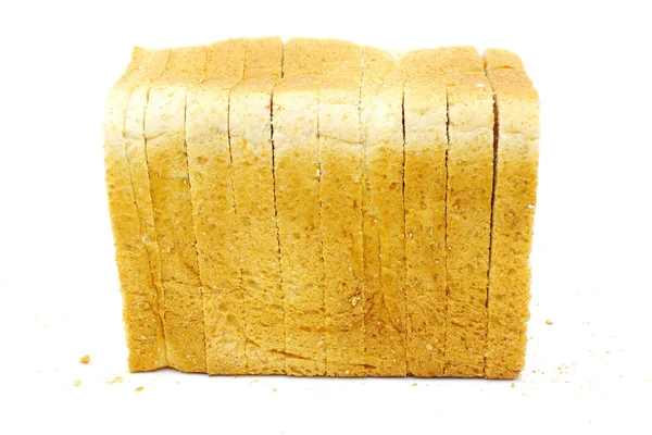Laib Brot auf Weiß schneiden — Stockfoto
