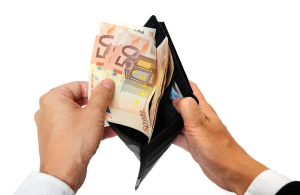 Man's hand pulling cash from the wallet — Stock Photo, Image