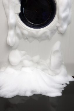 soap coming out from broken washing machine clipart