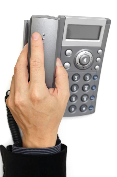 Business man's hand is picking up headset — Stock Photo, Image