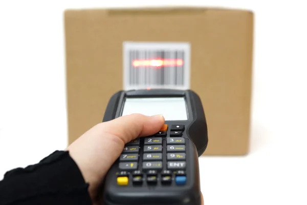 Woman hold scanner and scans barcode with laser — Stock Photo, Image