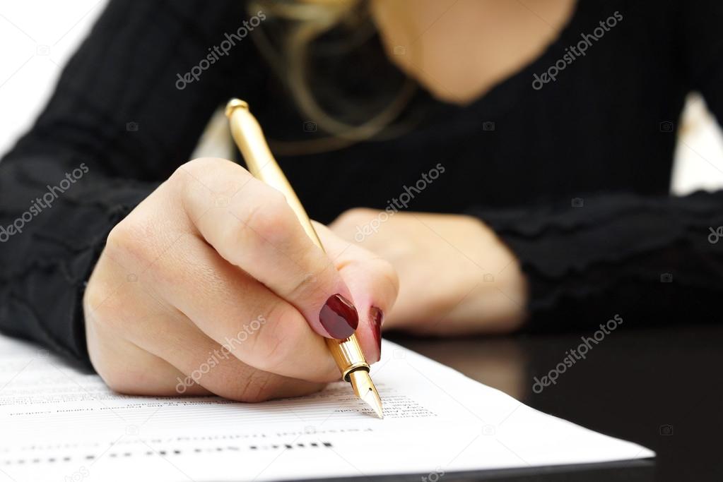 Woman is writing document