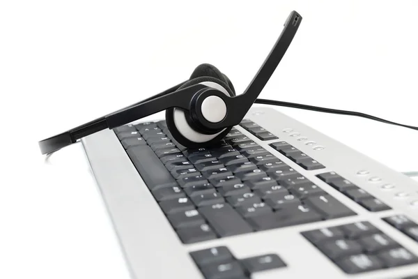 Müşteri hizmet kavramı klavye ve kulaklık — Stok fotoğraf