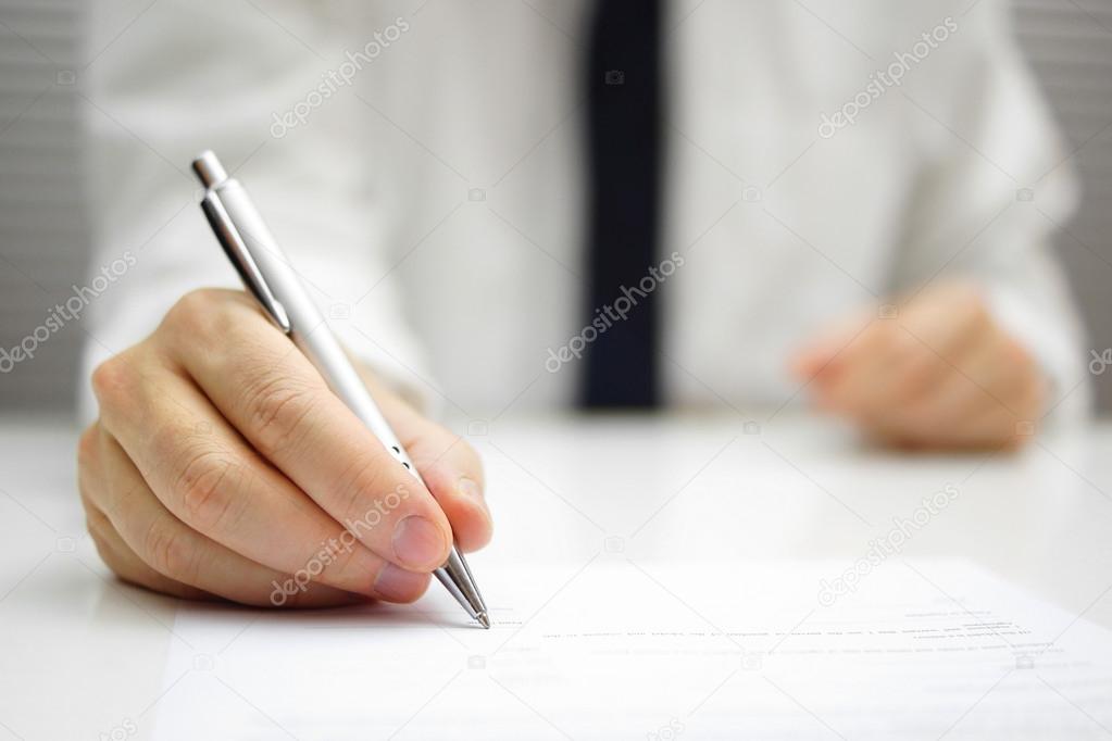 businessman is signing contract