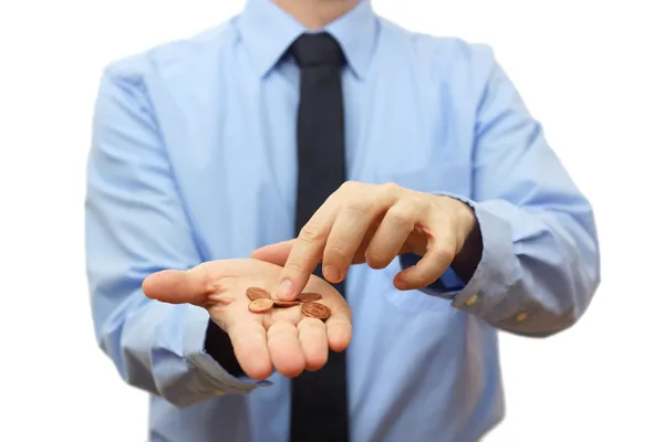 Бізнесмен рахує монети на руках. Концепція кризи — стокове фото
