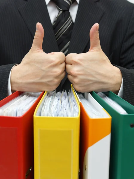 Good accounting or business service with thumb up on binders — Stock Photo, Image