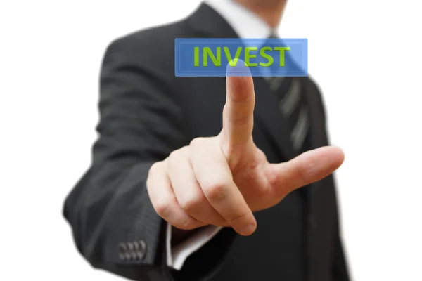 Affärsman röra virtuella uppvisning med invest word. isolerade — Stockfoto