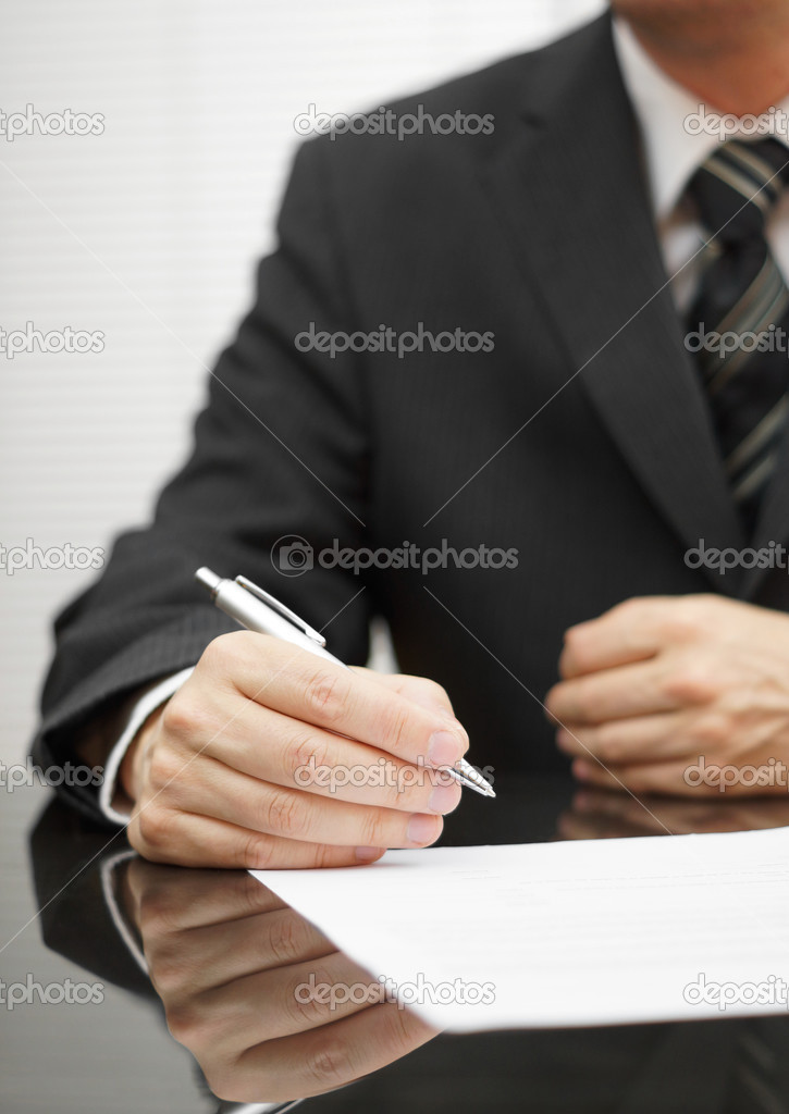 businessman thinking about a deal to sign