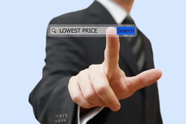 Biznesmen dotykając najniższa cena słowo w pasku wyszukiwania — Zdjęcie stockowe