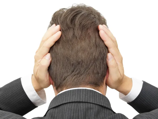 Empresário bloqueando seus ouvidos com as mãos — Fotografia de Stock