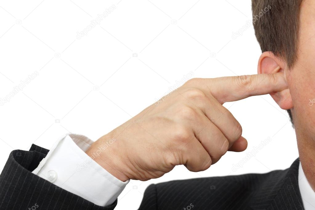 businessman blocking his ears with fingers .