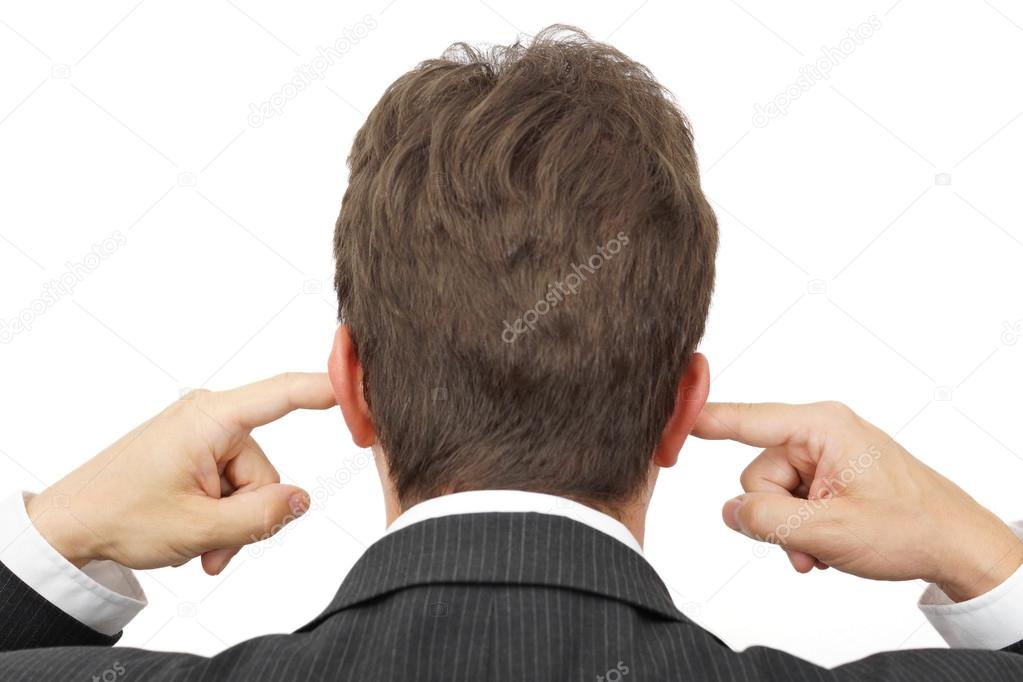 businessman blocking his ears with fingers .
