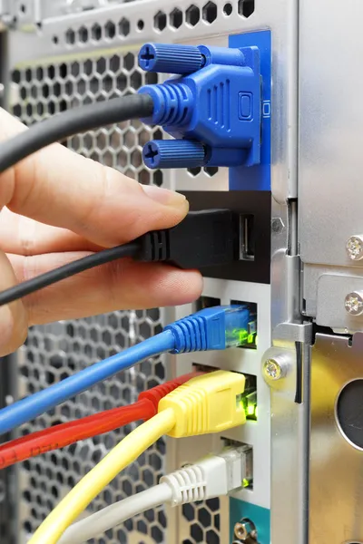 Technician is connecting device to a server — Stock Photo, Image