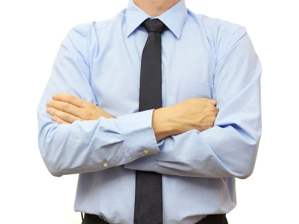 Empresario con camisa azul y corbata con las manos cruzadas — Foto de Stock