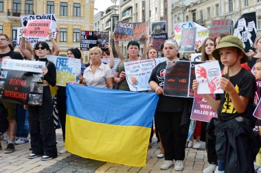 KYIV, UKRAINE - 2022/08/04: People hold placards with the slogan during a rally in support of the fighters of the Azov battalion, who were tortured by the Russian military on July 29, 2022 in the Olenivka concentration camp in the occupied territory 
