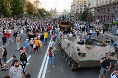 People inspect the destroyed equipment of the Russian army displayed at Khreshchatyk in the center of Kyiv. Ukrainians will celebrate the 31st anniversary of Independence Day on August 24, 2022. Russia invaded Ukraine on February 24, 2022, triggering