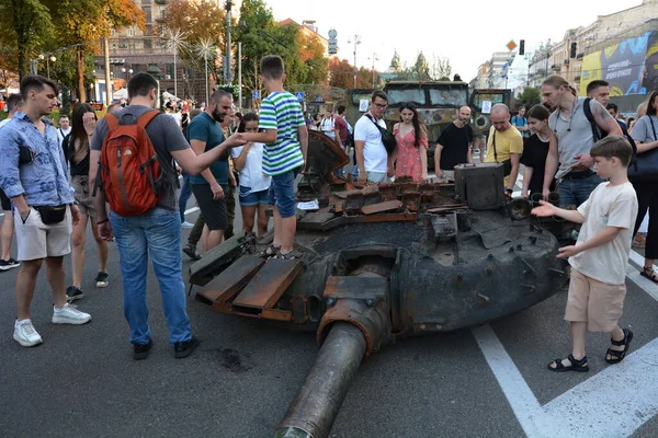 People inspect the destroyed equipment of the Russian army displayed at Khreshchatyk in the center of Kyiv. Ukrainians will celebrate the 31st anniversary of Independence Day on August 24, 2022. Russia invaded Ukraine on February 24, 2022, triggering
