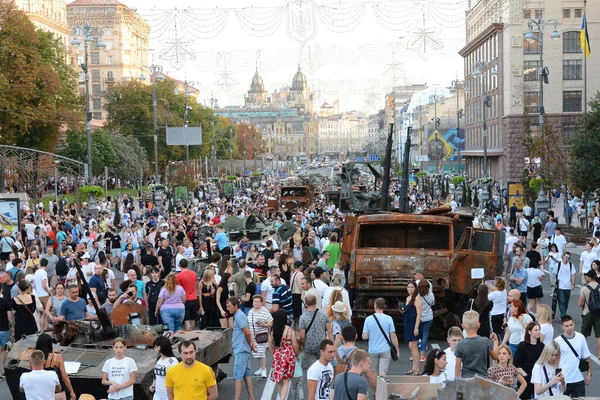 People inspect the destroyed equipment of the Russian army displayed at Khreshchatyk in the center of Kyiv. Ukrainians will celebrate the 31st anniversary of Independence Day on August 24, 2022. Russia invaded Ukraine on February 24, 2022, triggering