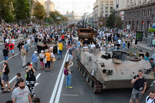 People inspect the destroyed equipment of the Russian army displayed at Khreshchatyk in the center of Kyiv. Ukrainians will celebrate the 31st anniversary of Independence Day on August 24, 2022. Russia invaded Ukraine on February 24, 2022, triggering