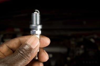 Mechanic and spark plug clipart