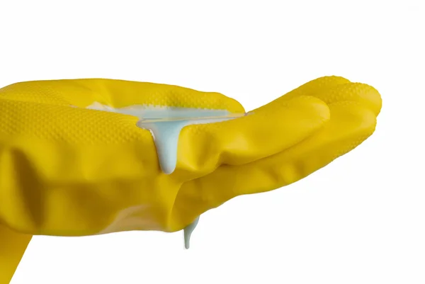 Gele handschoenen met vloeibare zeep reinigen — Stockfoto
