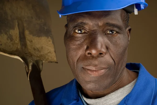 Construction Worker Resting Shovel on Shoulder — Stock Photo, Image