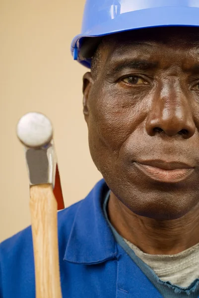 Construction worker holding hammer — Stock Photo, Image