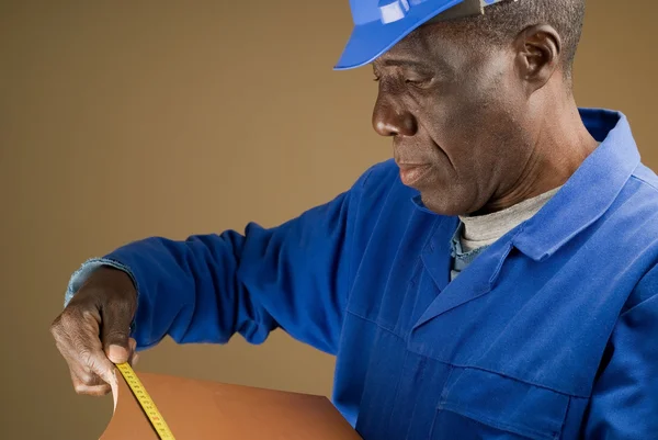 Construction Worker Measuring Tile — Stock Photo, Image