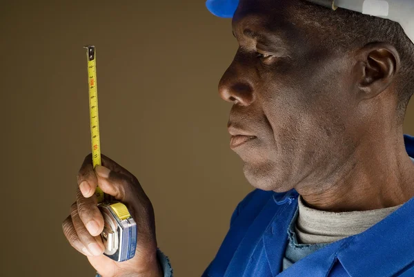 Construction Worker with Measuring Tool — Stock Photo, Image