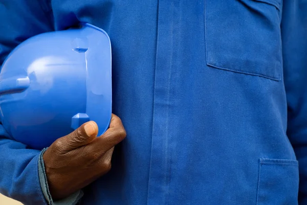 Construction worker holding hard hat — Stock Photo, Image