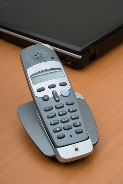 Office telephone and laptop — Stock Photo, Image