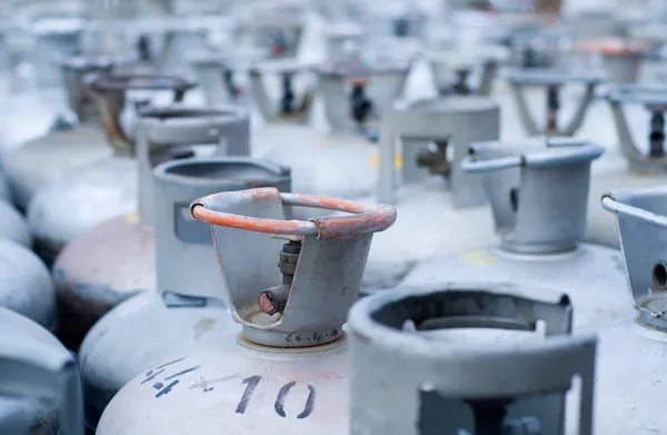 Metal LPG gas bottles in storage Stock Image