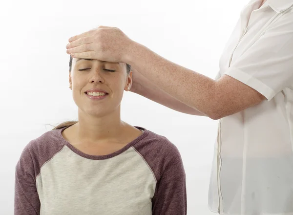 Kinesiologist treating Neuro vascular holding - emotional stress release — Stock Photo, Image