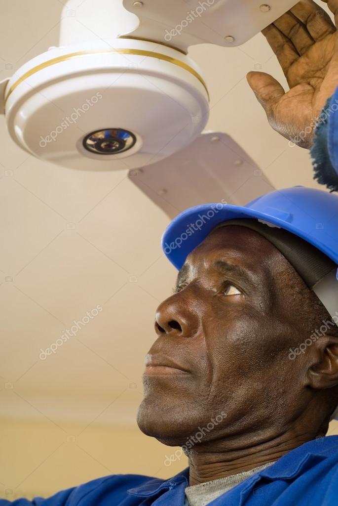 Construction Worker Fixing Ceiling Fan — Stock Photo ...